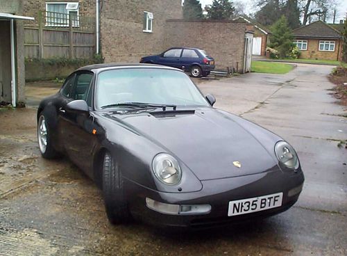 This is a 1995 N reg carrera 4 993 in black metallic with grey half leather